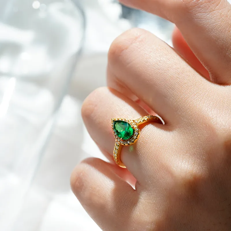 1.5 CT. Pear-Shaped Emerald Ring with White Sapphire Halo Accents