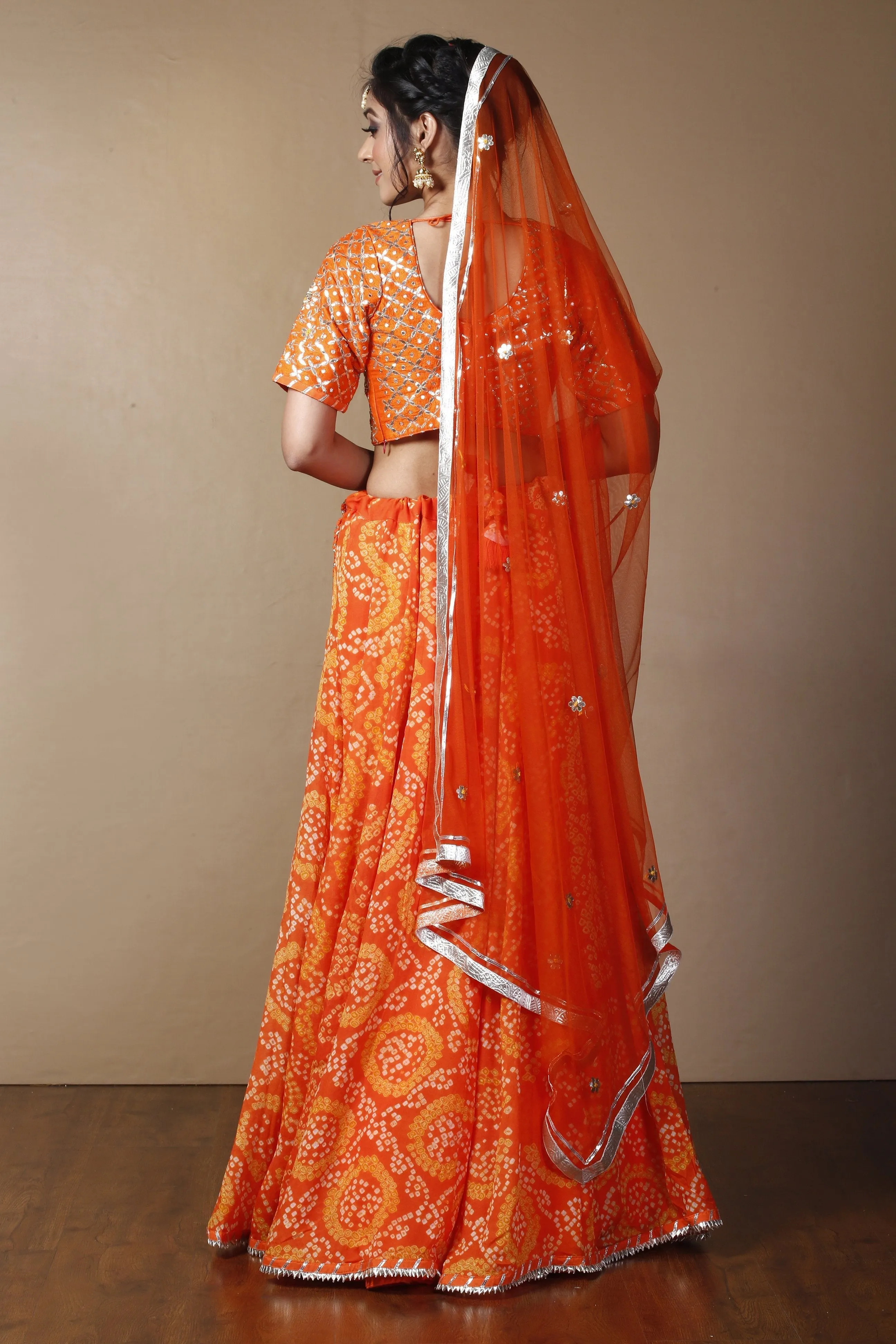 Bandhej Georgette Lehenga in Orange color with Gota Patti, Thread, Zardozi work.