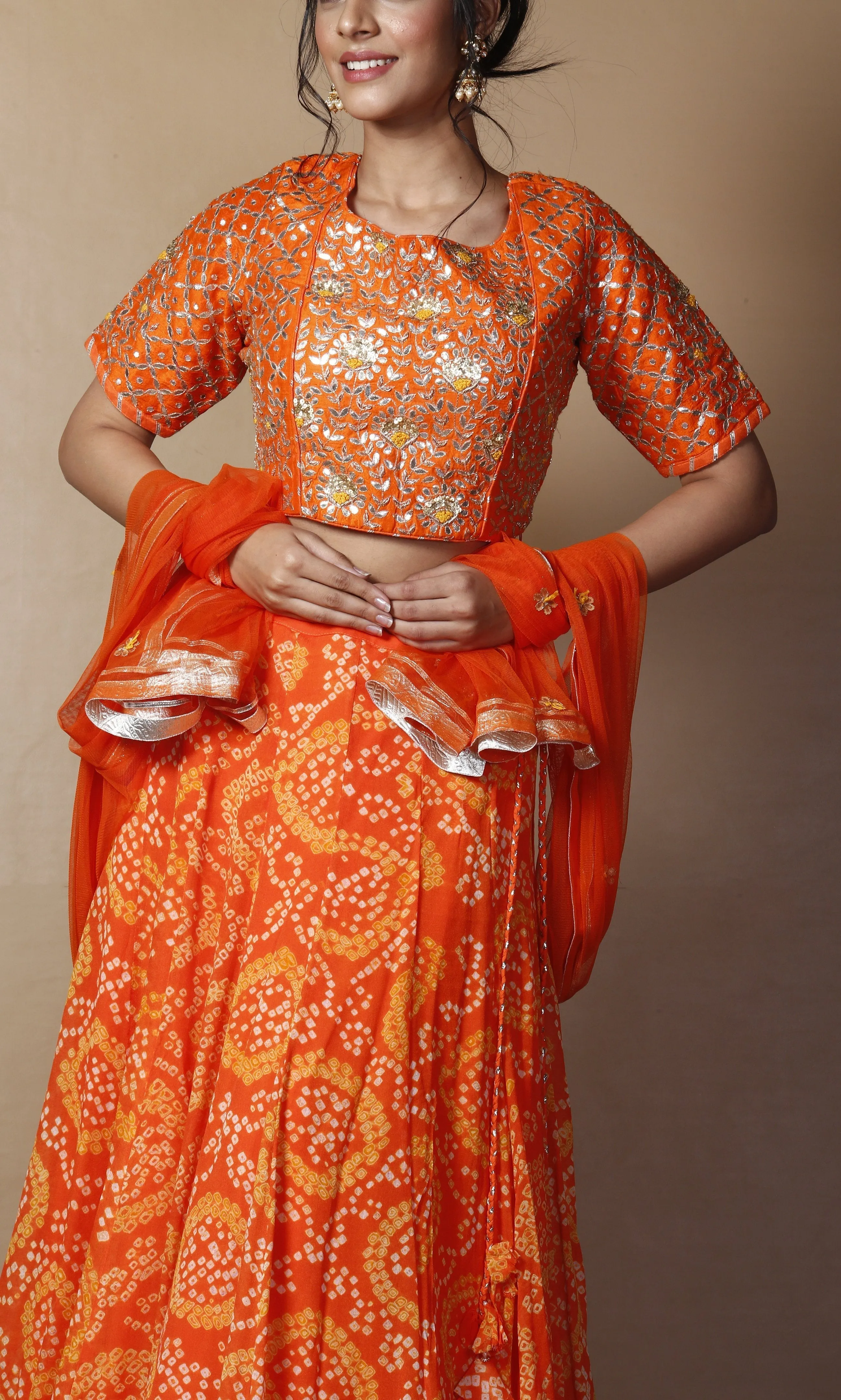 Bandhej Georgette Lehenga in Orange color with Gota Patti, Thread, Zardozi work.