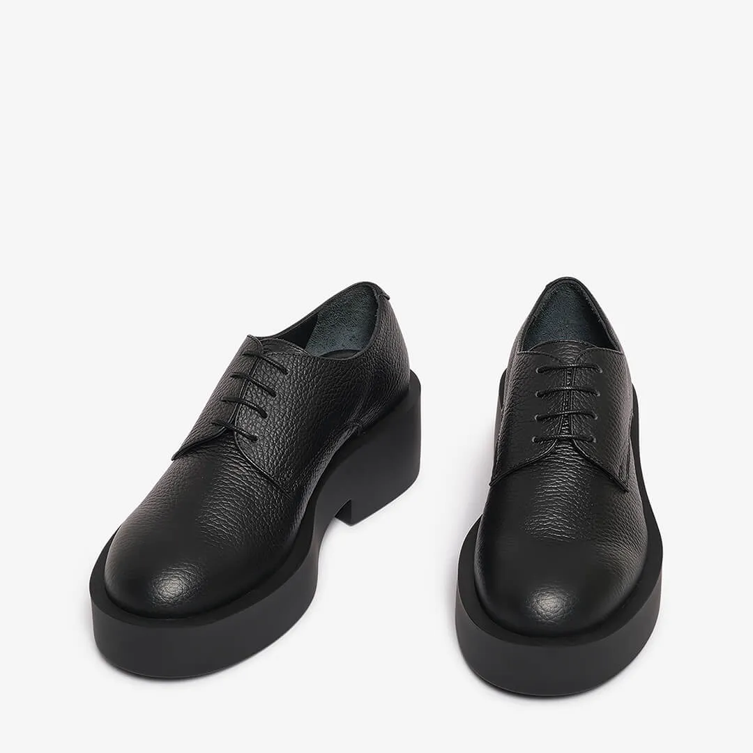 Black women's textured leather derby